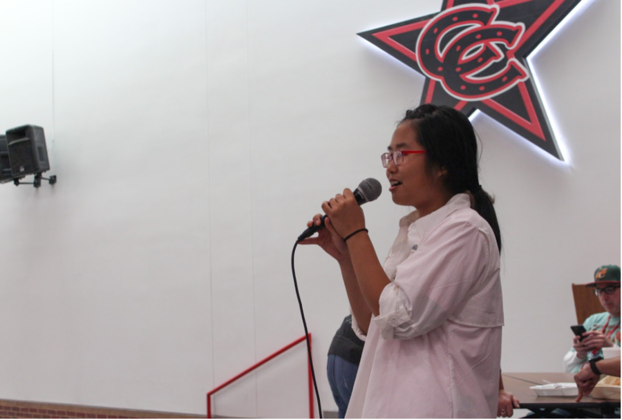 Coppell High School junior class president Lily Lee announces  homecoming dance ticket sales in the cafeteria during B lunch on Oct. 23. 