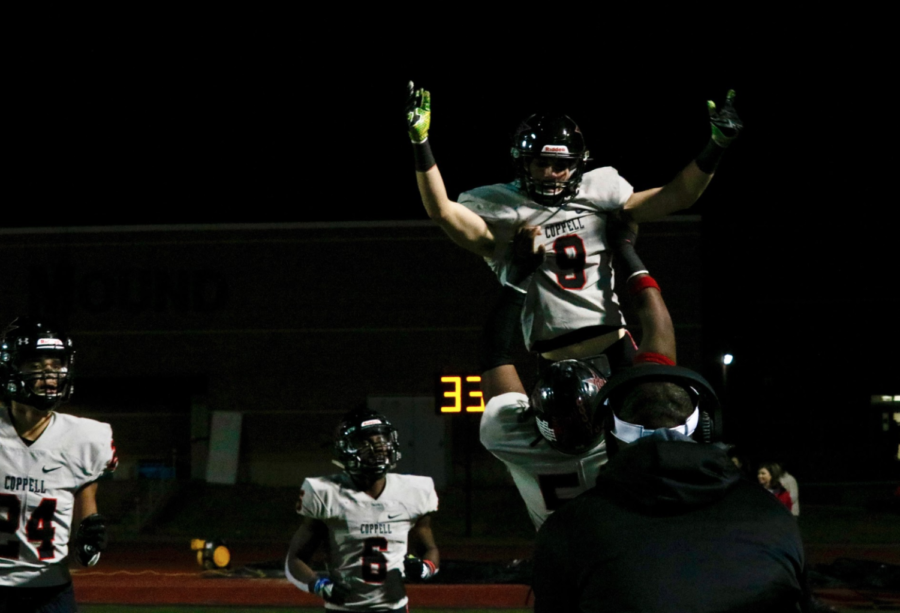Coppell senior wide receiver Mason Paschall celebrates after making a catch at Neal E. Wilson Stadium on Friday night. The Cowboys lost playoff hopes as they fell, 62-47, to Flower Mound.