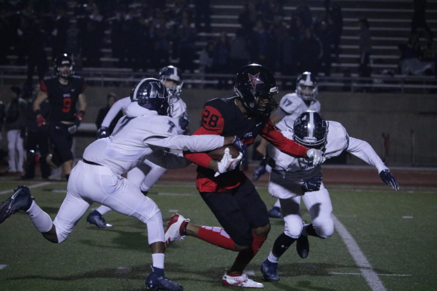 Coppell senior running back Tyrese Ward escapes Irving Nimitz defenders during the game on Friday at Buddy Echols Field. The Cowboys ended their season with a 49-13 win over Nimitz.