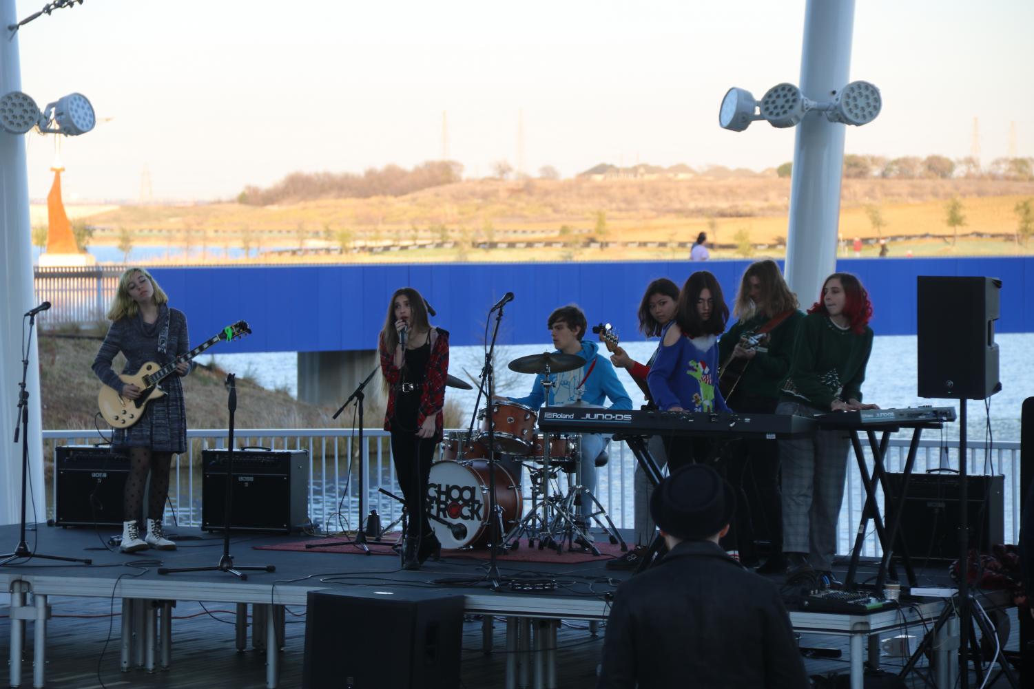 Students of the Dallas School of Rock perform various rock covers of traditional Christmas songs at a Christmas event at The Sound in December 2019. North Lake and the bordering Cypress Waters development carry a complex history involving construction and controversy. 