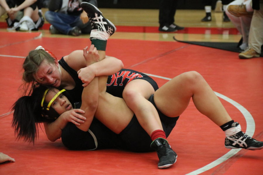 Coppell senior Brooke Massaviol tries to pin junior Kiya Tillery from The Colony. The Cowgirls placed first overall in the Knockout Sportswear Cowgirl Classic on Friday in the CHS Arena.