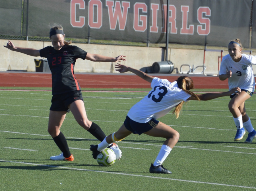 Coppell sophomore defender Bailey Peek steals the ball from a Little Elm midfielder during Saturday’s scrimmage at Buddy Echols Field. The Cowgirls tied with the Lady Lobos, 1-1. 