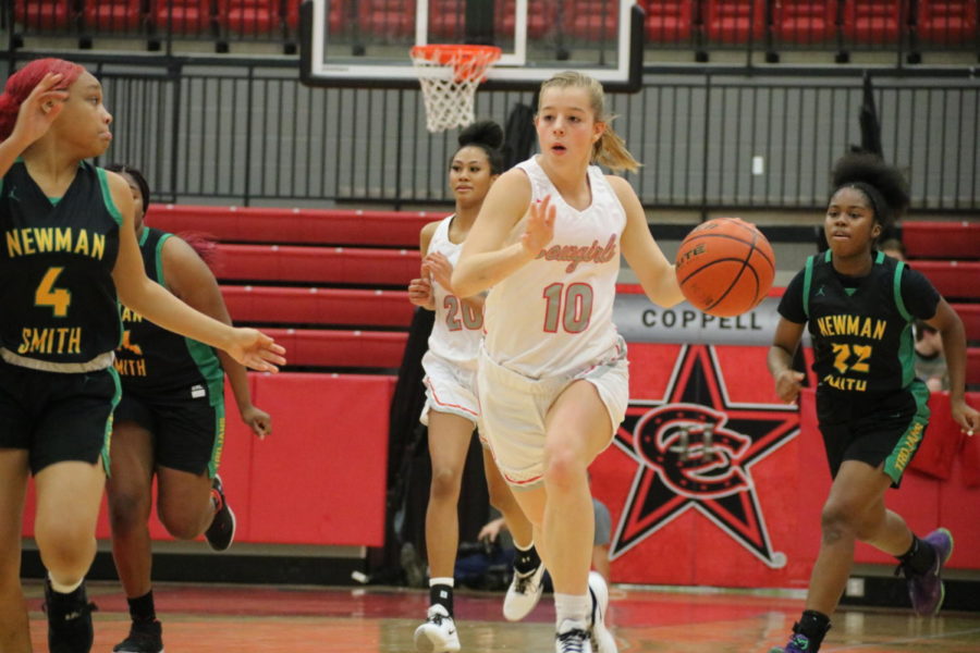Coppell+junior+guard+Emma+Sherrer+runs+a+fast+break+against+Newman+Smith+in+the+CHS+Arena+on+Tuesday.+The+Cowgirls+defeated+the+Lady+Trojans%2C+67-20.