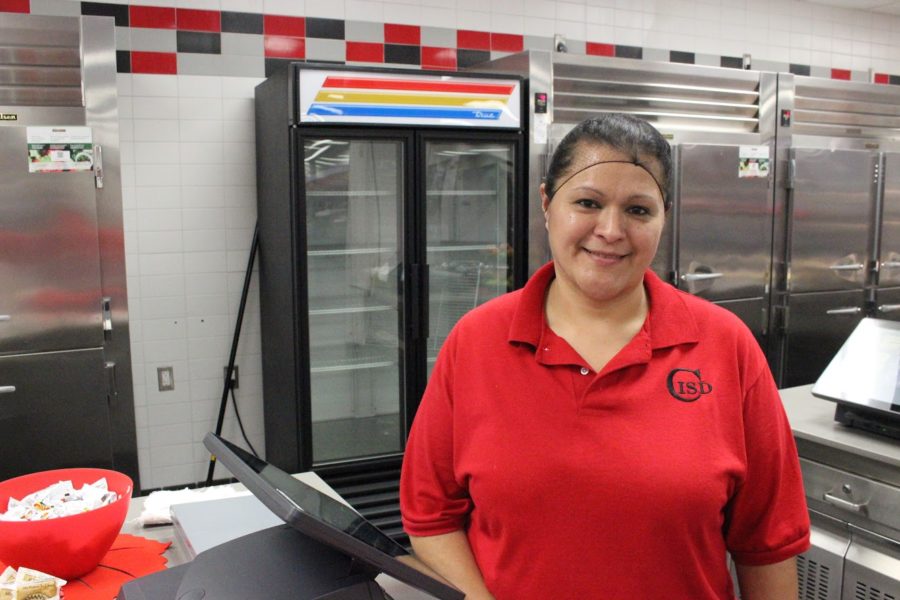 Coppell High School cafeteria manager Lillian Cruz leads a team of more than a dozen cafeteria workers every day. When in food preparation, Cruz prepares enough meals for close to half of the school.
