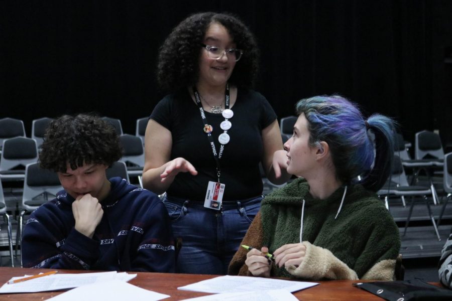 New Tech High @ Coppell junior Isabella Enriquez, with sophomore Brendan Raley and junior Raquel Andrews, directs rehearsal for the upcoming Coppell High School student-directed play “12 Angry Jurors” on Monday, Jan. 13. The play, a gender-neutral version of the original play, “12 Angry Men”, is showing from Feb. 21-23.