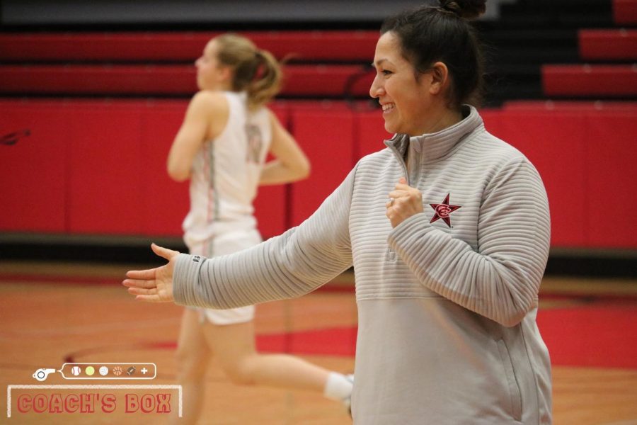 Coppell assistant girls basketball coach Julieann Hartsburg high fives players during the pregame introduction during their District 6-6A game against Irving. Hartsburg previously worked as the street team coordinator for the Dallas Mavericks.
