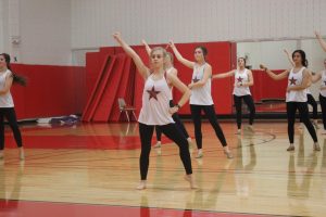 Coppell High School junior Kennedy McCann practices a contemporary piece with the Lariettes during fifth period on Jan. 17 in the small gym. McCann was in the Netflix show “Dancing Queen” with the dance team Beyond Belief.  