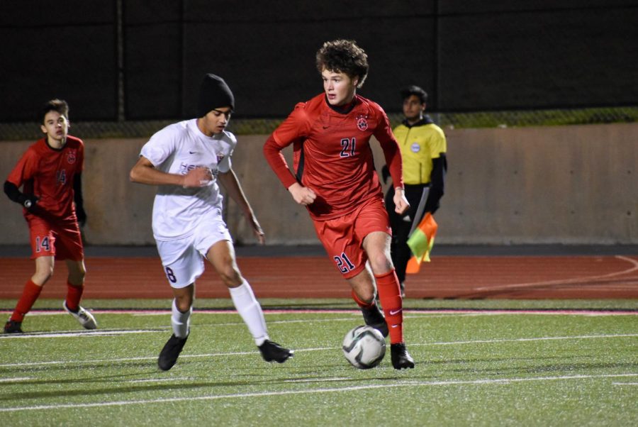 Coppell senior defender Maxwell Winneker watches for an open pass during the scrimmage against Frisco Heritage on Dec. 17 at Buddy Echols Field. The Cowboys play Rockwall-Heath tonight at 7:30 p.m. at Buddy Echols Field for their last preseason match. 
