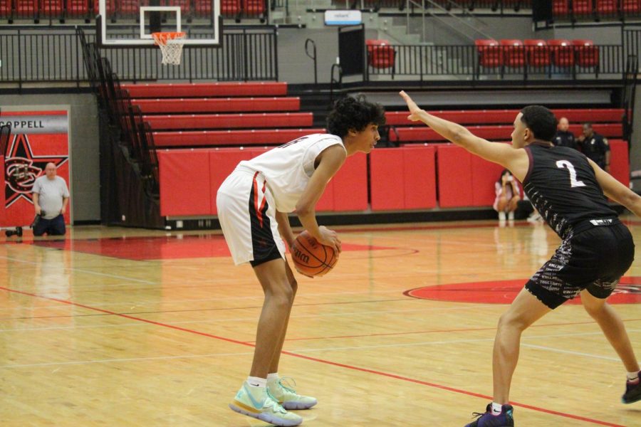 Coppell sophomore guard Ryan Agarwal attempts to make a play in the CHS Arena earlier this season against Timber Creek. The Cowboys play Irving tomorrow in the CHS Arena at 8 p.m.