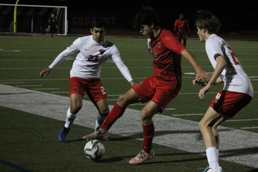 Coppell freshman forward Preston Taylor takes possession of a throw-in against Rockwall-Heath yesterday at Buddy Echols Field. The Cowboys defeated the Hawks, 2-0, in their final preseason match.