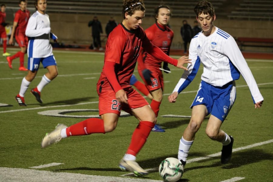 Coppell+senior+midfielder+Sebastian+Blaas+dodges+Hebron+senior+defender+Will+Bartley+on+Tuesday+at+Buddy+Echols+Field.+The+Cowboys+play+Lewisville+in+their+third+match+of+District+6-6A+play+at+7%3A30+p.m.+at+Buddy+Echols+Field+tomorrow.