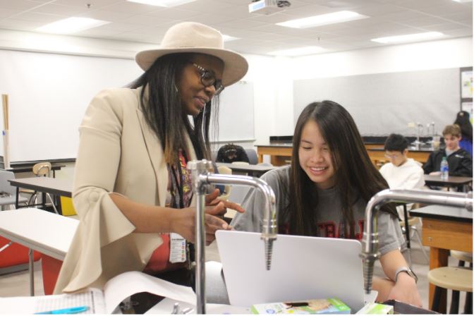 Coppell Forensic and Earth and Space Science teacher Lanissa Spear works with senior Nawawan (June) Poopanead during third period on Friday. Spear is an experienced teacher who came to Coppell from Chicago. 