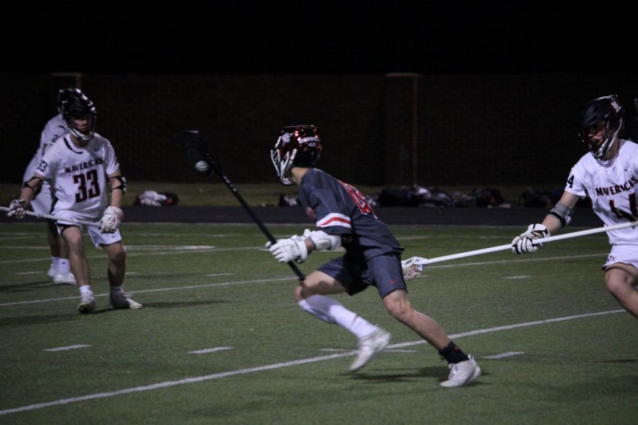 Coppell junior attacker Dylan Colon scores the fourth point against St. Johns on Friday at Coppell Middle School North. The Cowboys defeated the Mavericks, 10-5.