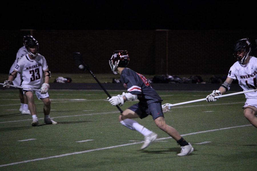 Coppell+junior+attacker+Dylan+Colon+scores+the+fourth+point+against+St.+Johns+on+Friday+at+Coppell+Middle+School+North.+The+Cowboys+defeated+the+Mavericks%2C+10-5.