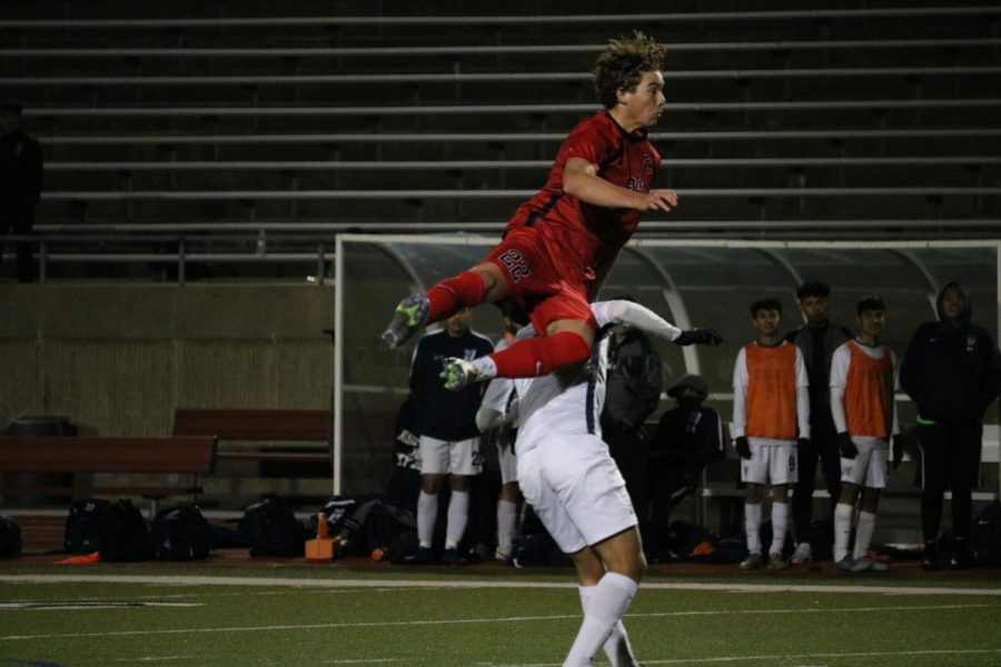 Coppell senior midfielder Sebastian Blaas jumps for a header against Nimitz on Feb. 18 at Buddy Echols Field. Nimitz came back from a two-goal deficit to defeat the Cowboys, 3-2.
