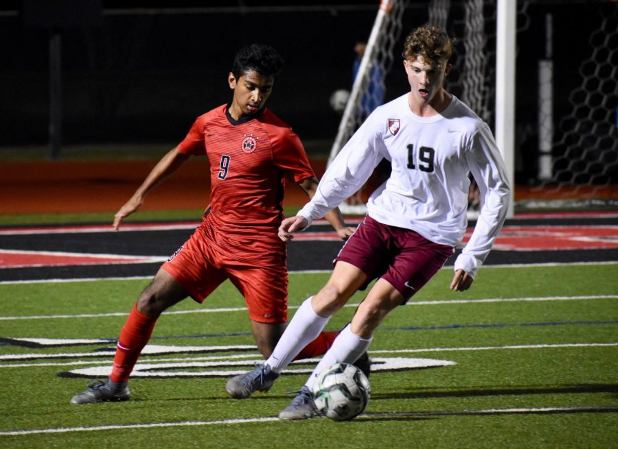 Coppell senior forward Tom Vazhekatt looks to tackle Lewisville junior midfielder Brody Webster against Hebron on Jan. 28 at Buddy Echols Field. The Cowboysplay MacArthur at 7:30 p.m. tonight at Buddy Echols Field.