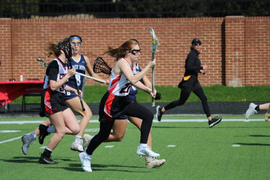 Coppell sophomore attacker Anna Terry races downfield against Flower Mound. Coppell lost to the Jaguars, 13-4, on Saturday at Coppell Middle School North. Photo by Ava Mora