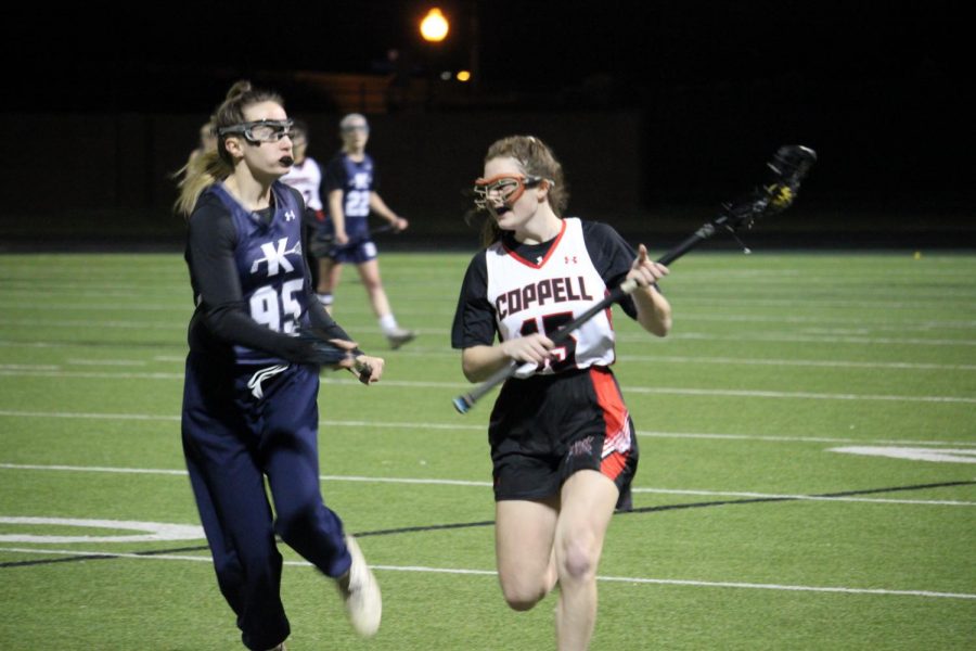 Coppell sophomore midfielder Sadie Harp tries to get past Keller sophomore midfielder  Sarah Spera. The Cowgirls lost to the Indians,15-7, on Thursday at Coppell Middle School North. 