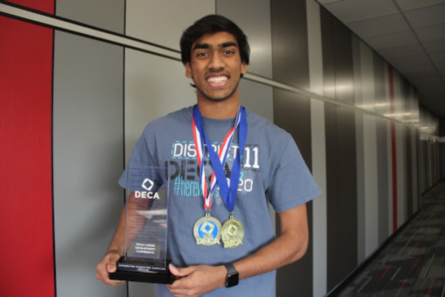 Coppell+High+School+senior+Rushil+Nakkana+displays+winnings+from+this+weekends+DECA+State+Career+Development+Conference+at+the+Fort+Worth+Convention+center.+In+these+competitions%2C+members+receive+business+scenarios+and+work+in+groups+of+two+to+find+a+solution+in+hopes+of+advancing+to+internationals.