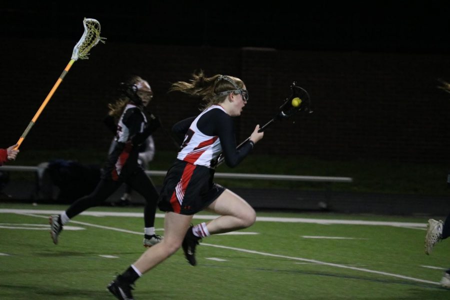 New Tech @ Coppell sophomore attacker Finley Tipton cradles the ball last night against Allen at Coppell Middle School North. The Cowgirls face Flower Mound at CMS North tomorrow at 11 a.m. 