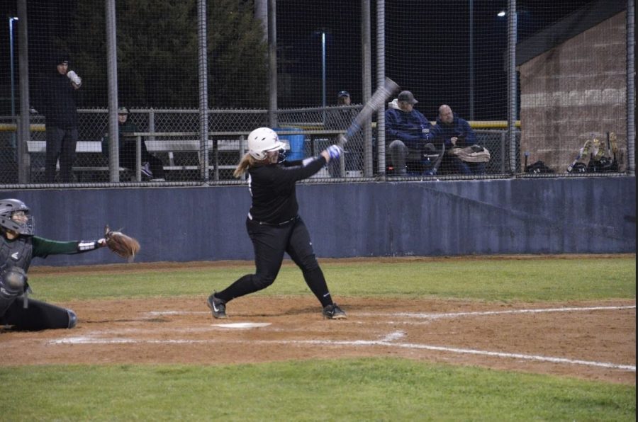 Coppell+junior+pitcher+Michaella+Baker+hits+the+ball+across+the+field+during+Friday+night%E2%80%99s+scrimmage+against+Prosper+at+the+CISD+Baseball%2FSoftball+Complex.+The+Cowgirls+lost+against+the+Eagles%2C+4-5.+