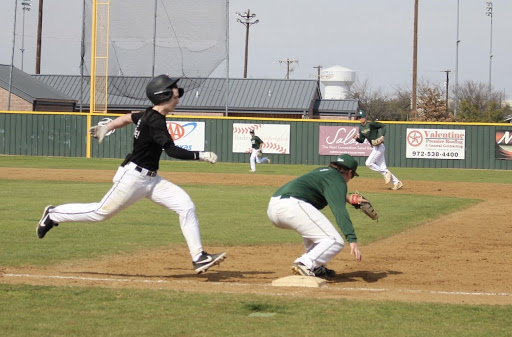 Coppell junior second baseman Tony Vernars is thrown out at first against Birdville on Saturday. Coppell played its first home scrimmage at the Coppell ISD Baseball Complex.