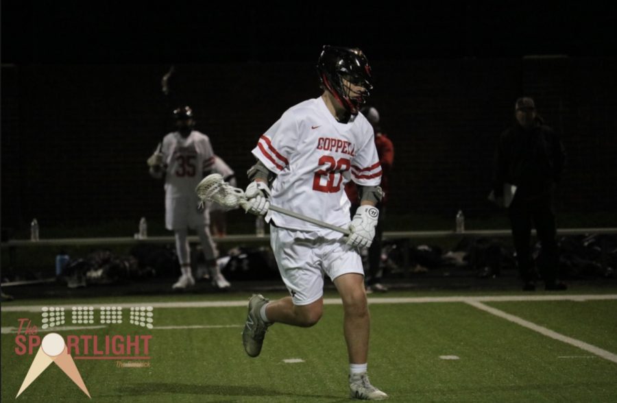 Coppell sophomore JV midfielder Alexander Haydek attempts to shoot on Feb. 12 at Coppell Middle School North. Haydek started playing lacrosse in seventh grade and volunteers at Bridge Lacrosse as an assistant coach.
