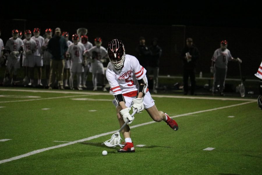 Coppell+junior+midfielder+Andrew+Sullivan+gains+possession+against+St.+Johns+on+Friday+at+Coppell+Middle+School+North.+The+Cowboys+take+on+Frisco+at+7%3A30+p.m.+tomorrow+at+Coppell+Middle+School+North.