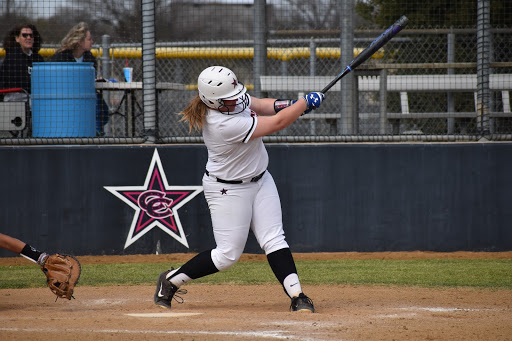 Coppell junior pitcher Michaella Baker swings against Cedar Hill yesterday at the Coppell ISD Softball Complex. The Cowgirls defeated Cedar Hill, 7-5, in their last game of the Coppell & Marcus Tournament.  