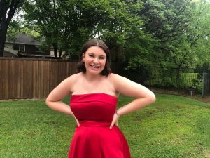 Coppell High School senior Carrie Sheffield wears the dress she planned to wear to Coppell High School prom on April 4 at AT&T Stadium. Due to the spread of the coronavirus, this year’s prom was canceled. 