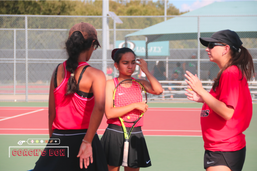 Coppell assistant Natalie Landa coaches junior Rishita Uppuluri and senior Rifhat Sindhi, following up the match against Longview at the CHS Tennis Center on Sept. 28. Landa is using her tennis coaching experiences to work virtually with the Coppell tennis team.