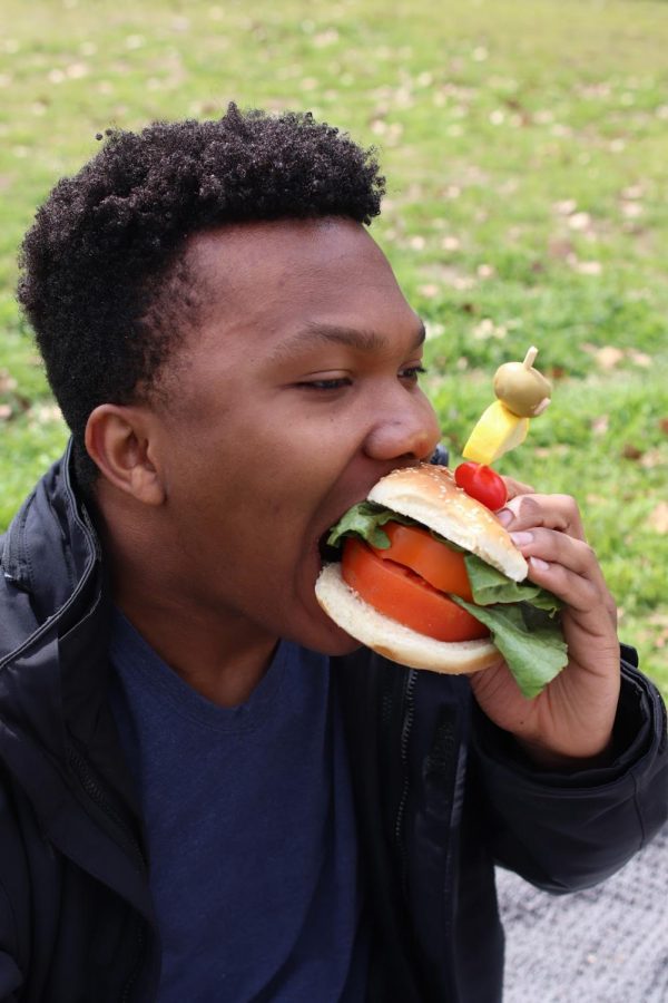 Coppell High School senior CJ Konwe eats a meatless burger. Veganism/plant-based eating is becoming more popular due to a changing culture and increased dining options.
