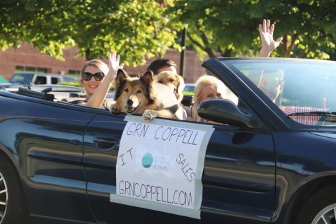 Members of the Global Recruiters of Coppell promote their business by participating in a pop-up parade down Denton Tap Road on Thursday. In efforts to keep the local economy strong and maintain social distancing rules, residents were encouraged to order take-out from their favorite Coppell restaurant and have a picnic in their car as they watched the parade go by.