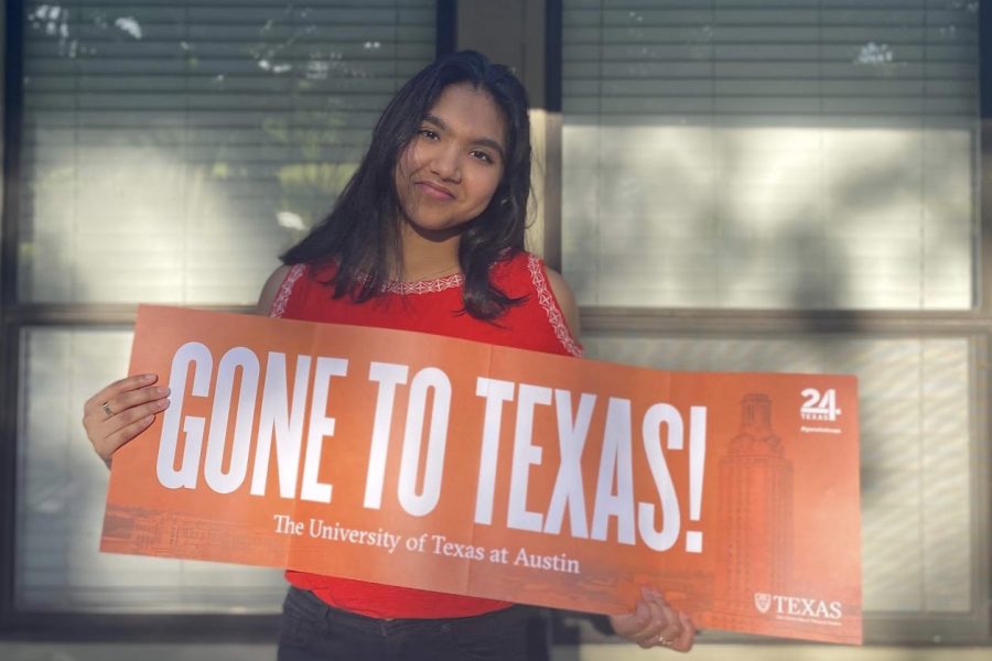 Coppell+High+School+senior+Varsha+Chintapenta+shows+off+her+acceptance+banner+to+The+University+of+Texas+at+Austin.+Chintapenta+is+attending+UT+for+industrial+design+this+fall.+