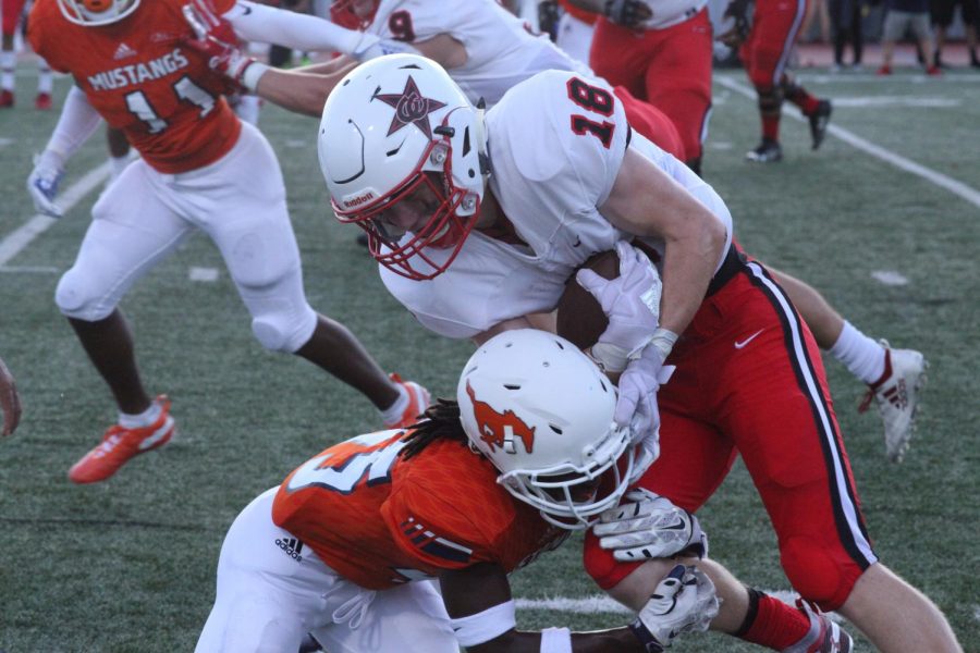 Coppell senior quarterback Ryan Walker pushes past Sashce on Aug. 30, 2019. Based on the adjusted UIL schedule, Coppell will begin 2020-21 fall sports on Sept. 7.