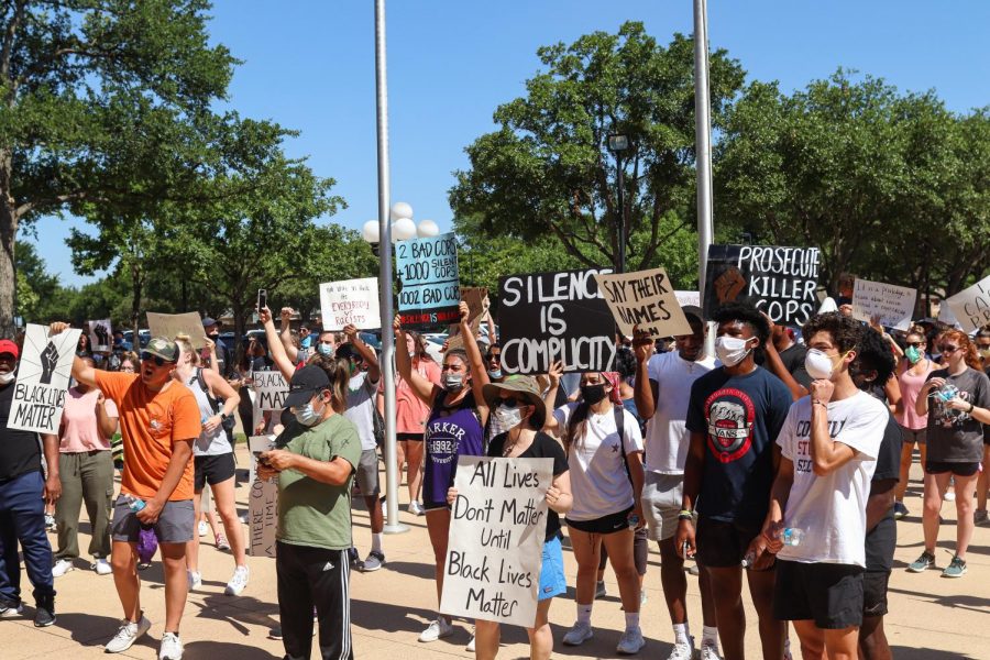 Protesters gather with signs at Coppell City Hall on June 6.  The Sidekick staff writer Yasemin Ragland hopes for more progress for racial equality.