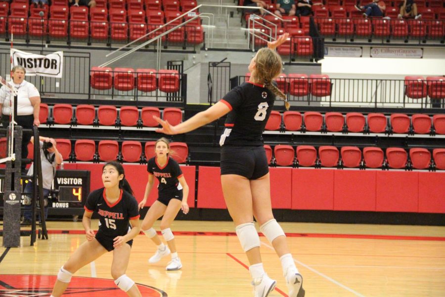 Coppell junior outside hitter Haley Holz spikes against Keller Central at the Coppell High School Arena on Friday. The Cowgirls won three of four preseason matches this weekend. 