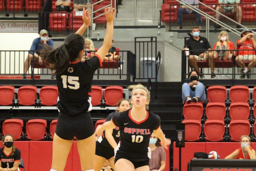 Coppell senior setter Mari Taira sets for sophomore outside hitter Reagan Engler against Keller Central at the CHS Arena on Friday. Tomorrow, the Cowgirls face McKinney Boyd at 5 p.m. and Weatherford at 8 p.m. in the CHS Arena. 