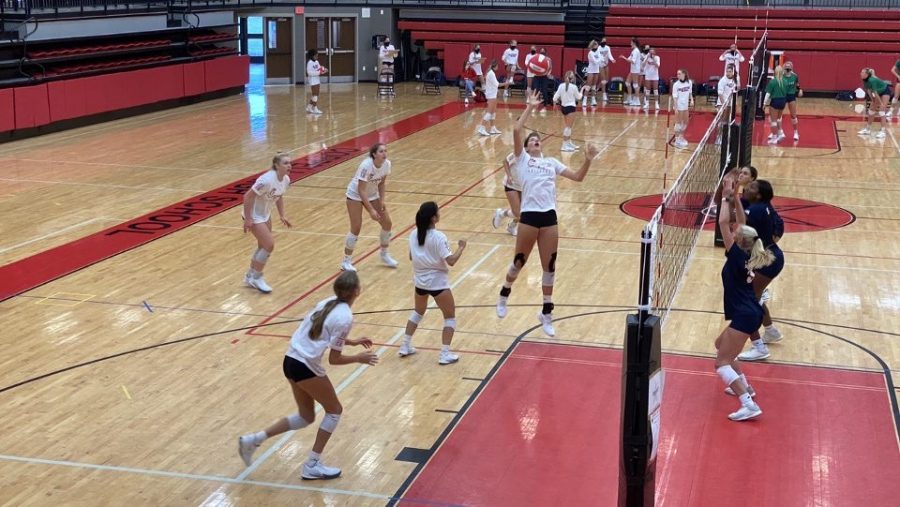 Coppell+junior+middle+hitter+Alessandra+Clent+spikes+the+ball+against+Eaton+on+Sept.+11+at+the+CHS+Arena.+The+Cowgirls+played+the+first+scrimmages+of+the+season+against+Sachse%2C+Eaton%2C+Grapevine+and+Richardson+this+weekend.+