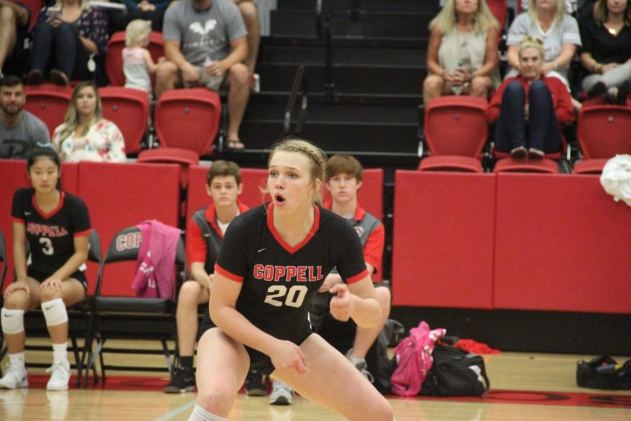  Coppell sophomore outside hitter Reagan Engler stands ready to receive as she watches her teammates against Grapevine on Sept. 10, 2019 in the CHS Arena. Coppell will take on Sachse, Grapevine and Eaton tomorrow at 5 p.m. in the CHS Arena for the first scrimmage of the season. 