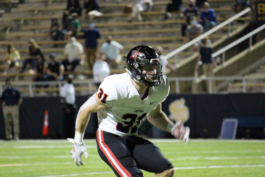 Coppell senior defensive back Will Kraus drops in coverage against Highland Park at Highlander Stadium on Oct. 9. Coppell lost to Highland Park, 42-36.

