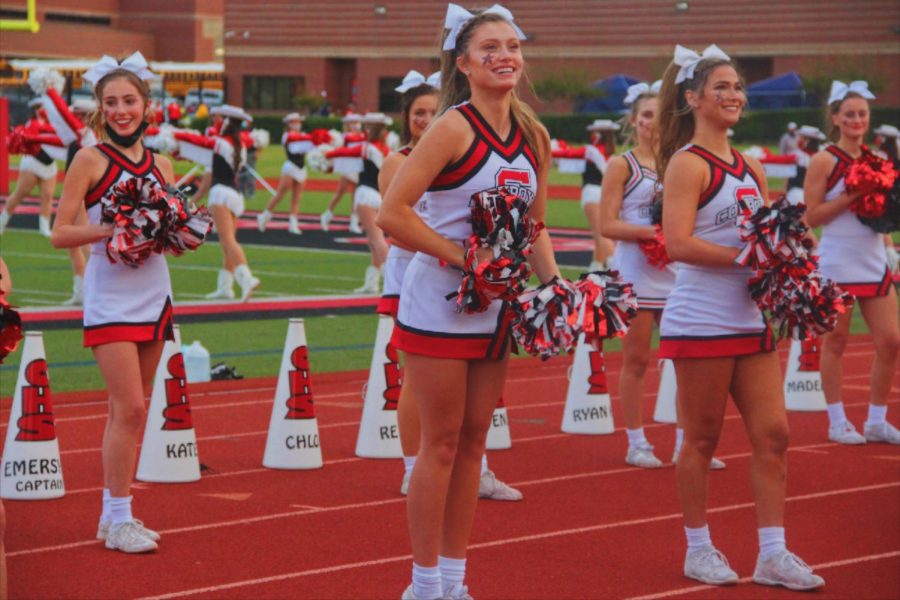 Coppell senior cheerleader Taylor Kniff excites the crowd on Friday at Buddy Echols Field. Coppell defeated Sachse, 42-35. 
