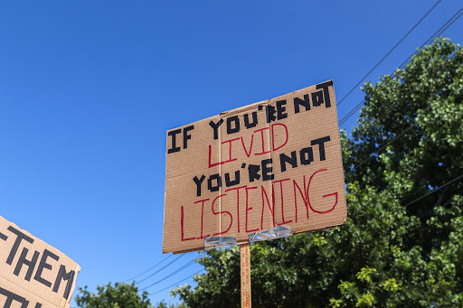 Coppell residents hold signs in the sky to protest against racial inequality on Sandy Lake Road on June 6. Coppell has recently experienced a burst of advocacy against racial inequality after the death of George Floyd. 