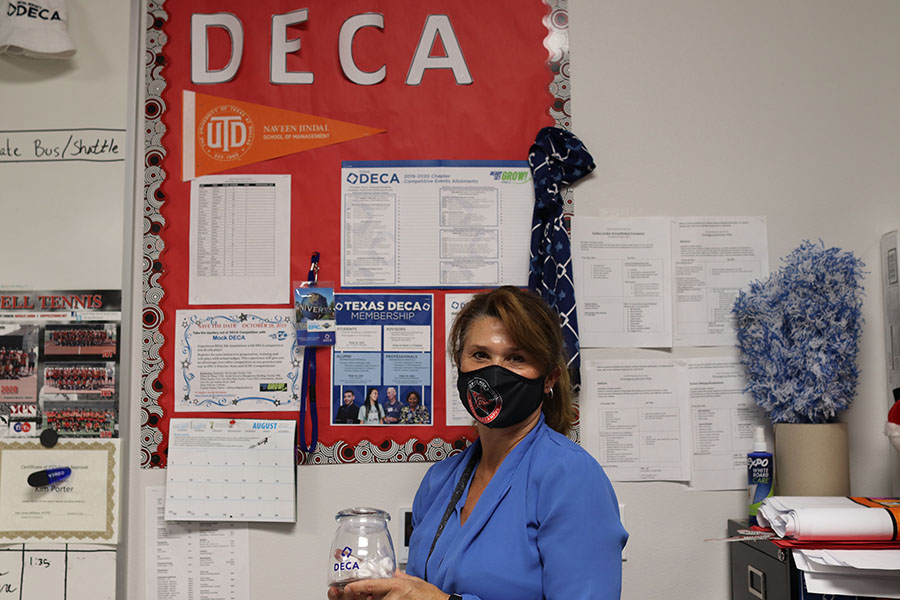 CHS9 Principles of Business, Marketing and Finance and Business Information Management teacher Kim Porter shows pride in Distributive Education Clubs of America (DECA) in her classroom on Thursday. Porter was selected as the CHS9 September Teacher Spotlight.  