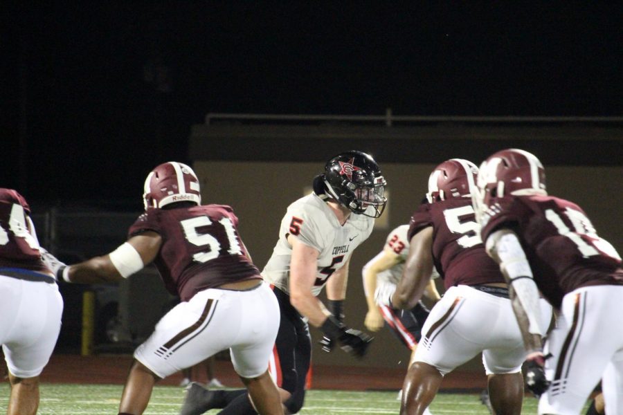 Coppell senior inside linebacker Tim O’Hearn eyes down the Mesquite offense on Friday at E.H. Hanby Stadium. The Cowboys face Sachse tomorrow in their home opener at Buddy Echols Field at 7 p.m.