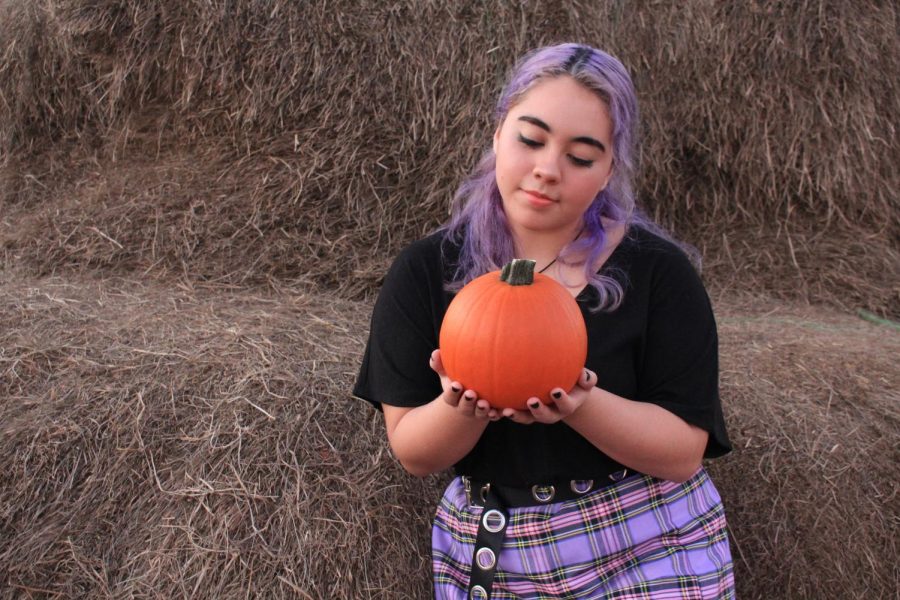 The Sidekick executive editorial page editor Camila Villarreal enjoys the fall season at the Flower Mound Pumpkin Patch on Monday. Due to COVID-19, fall has felt gloomy, but Villarreal emphasizes the importance of keeping the fall spirit alive.