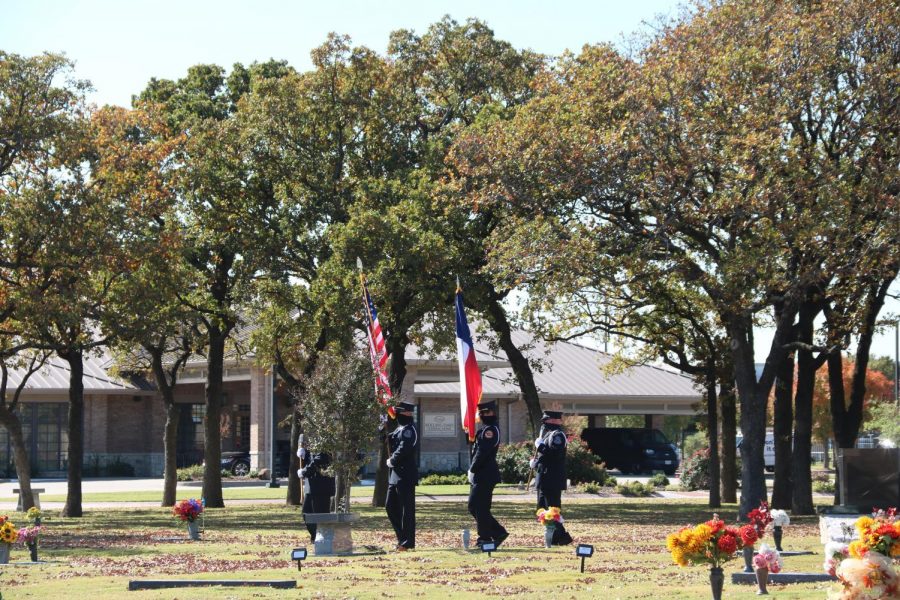 The Coppell Police Department carries the United States and Texas flags at Rolling Oaks Memorial Center on Nov. 11. Coppell residents gathered at the memorial center to honor those who served in the armed forces on Veterans Day.
