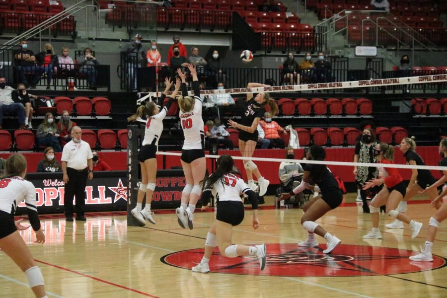 Coppell junior outside hitter Abby Hendricks and sophomore middle blocker Reagan Engler block against Marcus at the CHS Arena on Tuesday. Coppell suffered a 3-1 loss to Marcus, 25-13, 25-13, 22-25, 25-13, to bring its District 6-6A record to 2-3. 