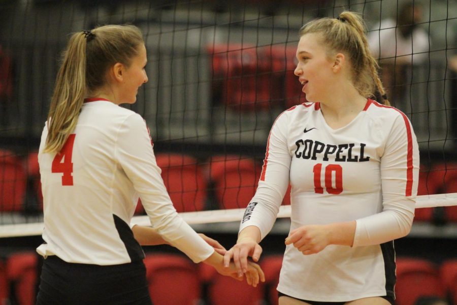 Coppell+junior+right+side+hitter+Abigail+Hendricks+and+sophomore+outside+hitter+Reagan+Engler+celebrate+against+Prosper+Rock+Hill+in+the+CHS+Arena+on+Friday.+Coppell+plays+Hebron+tomorrow+at+6%3A30+p.m.+in+the+CHS+Arena.