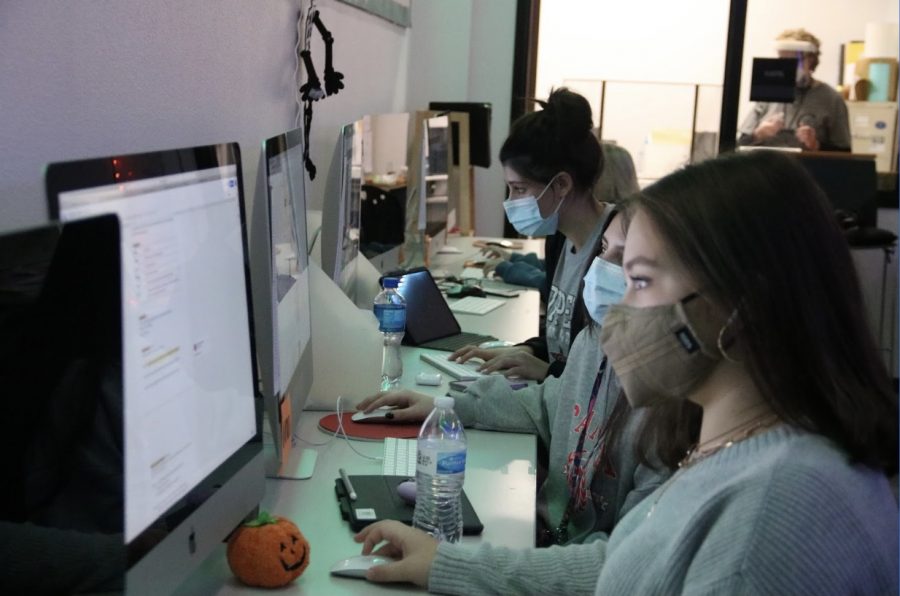Coppell High School sophomores Elena Ramey, Yasmine El-Ali and Belen Campos work on their assignment about creating content during 2nd period on Friday in A107. Despite the COVID-19 pandemic, there have been changes and regulations made within the yearbook program. Photo by Tracy Tran
